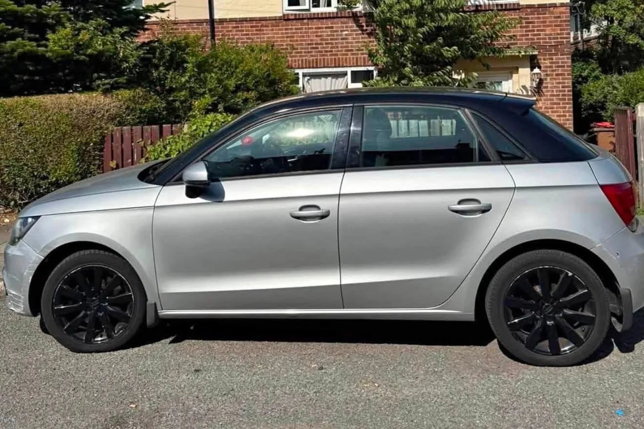 Silver Audi A1 Sportback with black roof and black alloy wheels, side profile