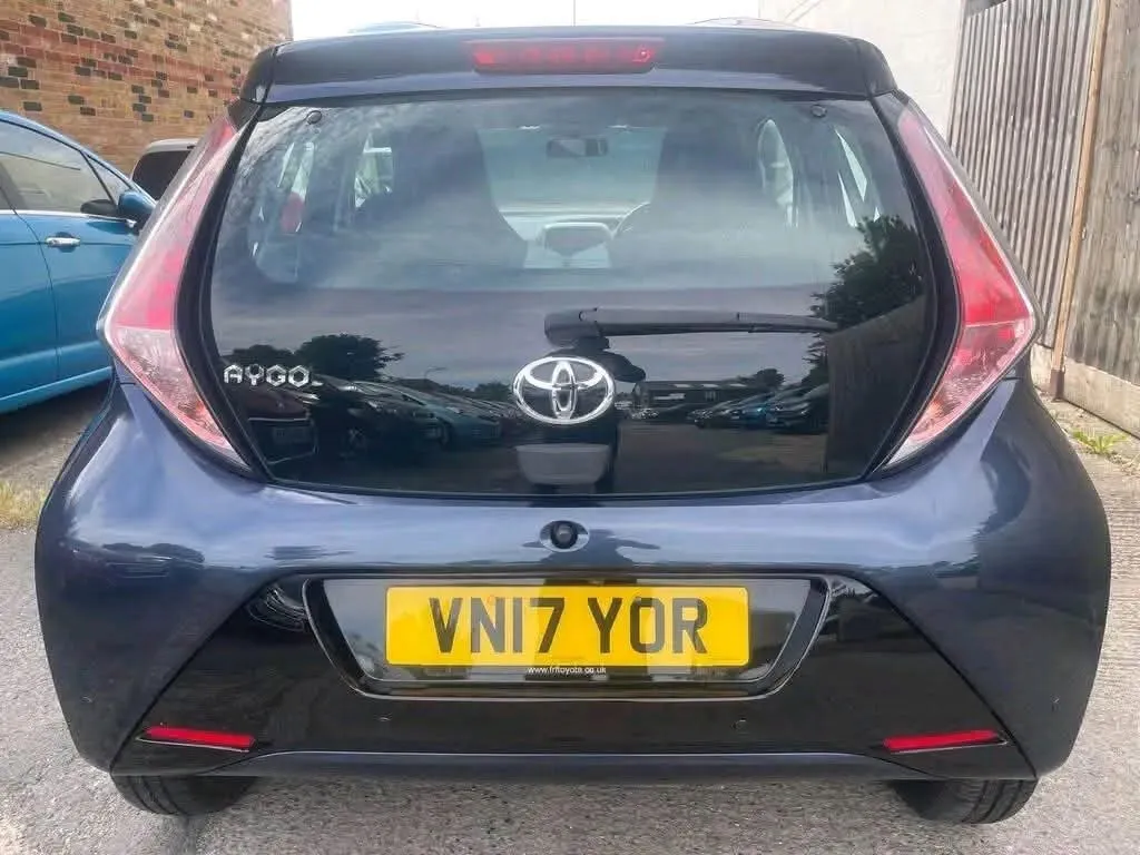 Dark blue Toyota Aygo, rear view with the tailgate spoiler and AYGO badge