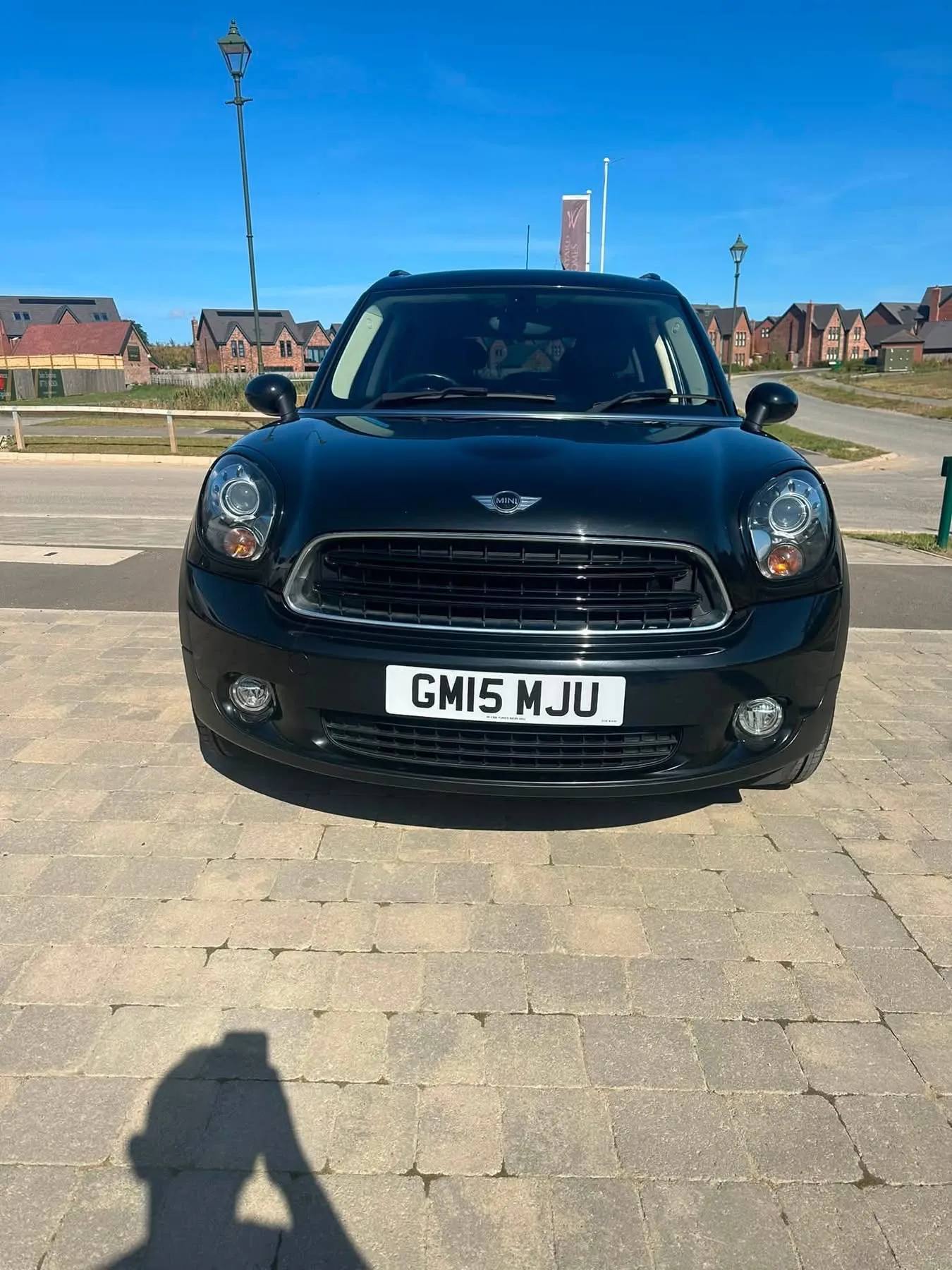 Black MINI Countryman Cooper, front view showing the registration GM15 MJU