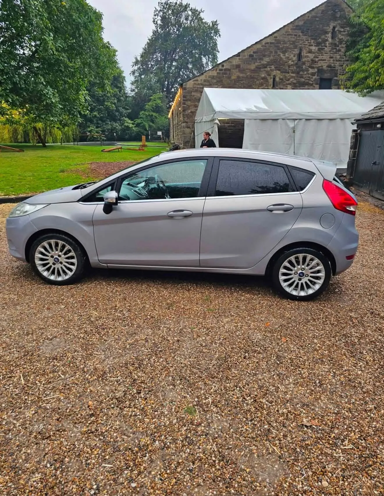 Silver Ford Fiesta Titanium, full side profile on alloy wheels