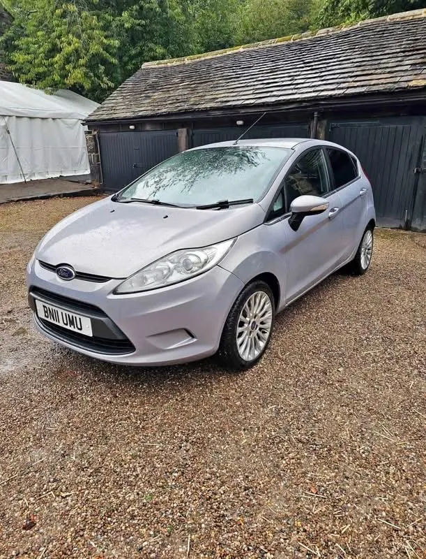 Silver Ford Fiesta Titanium, front three-quarter view from the passenger side