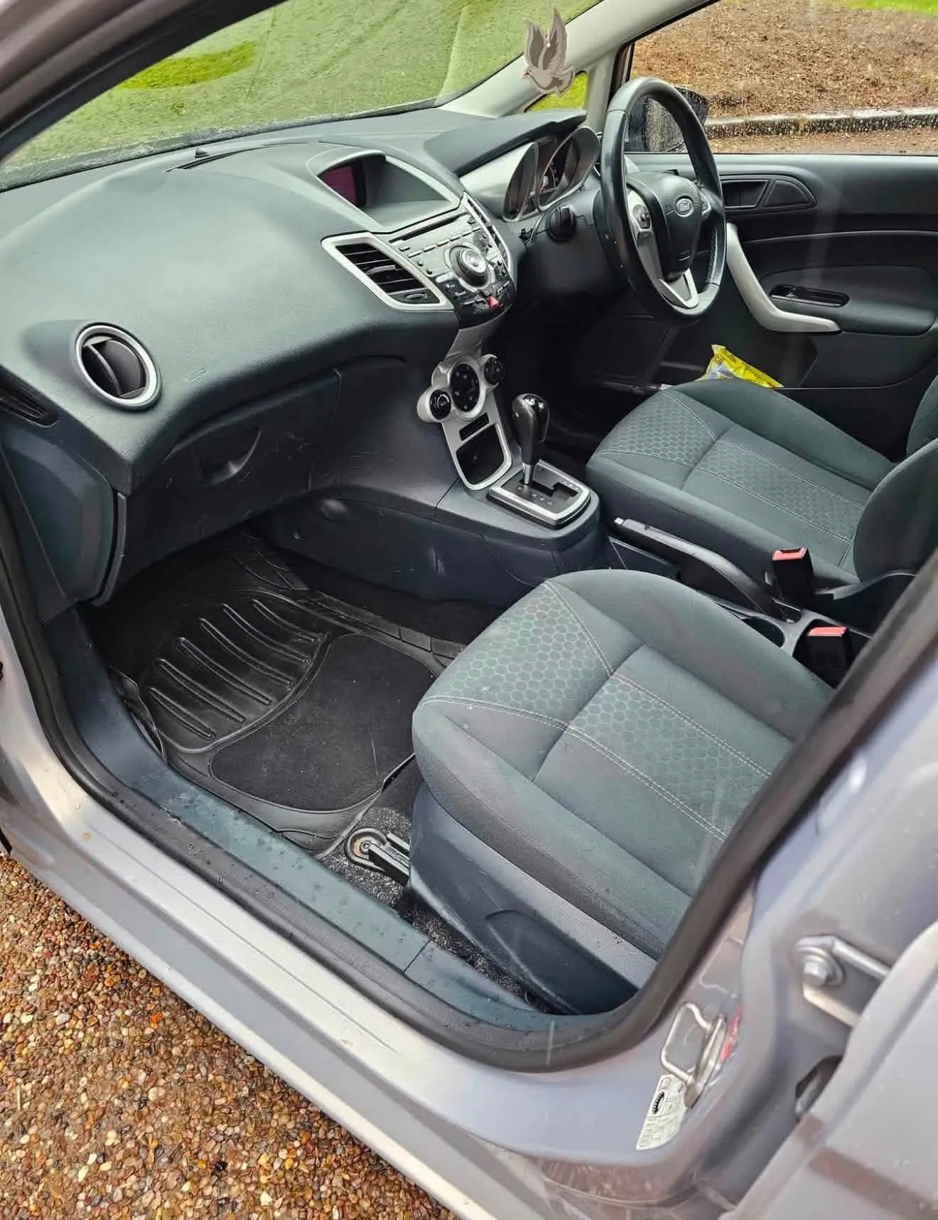 Ford Fiesta interior showing the automatic gear selector and grey cloth seats