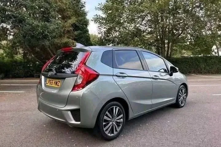 Silver Honda Jazz 1.3 CVT automatic, rear three-quarter view
