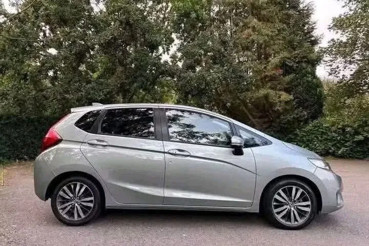 Silver Honda Jazz 1.3 CVT automatic, side profile