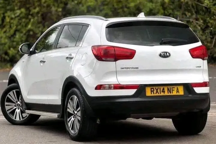 White Kia Sportage KX-4, rear three-quarter view